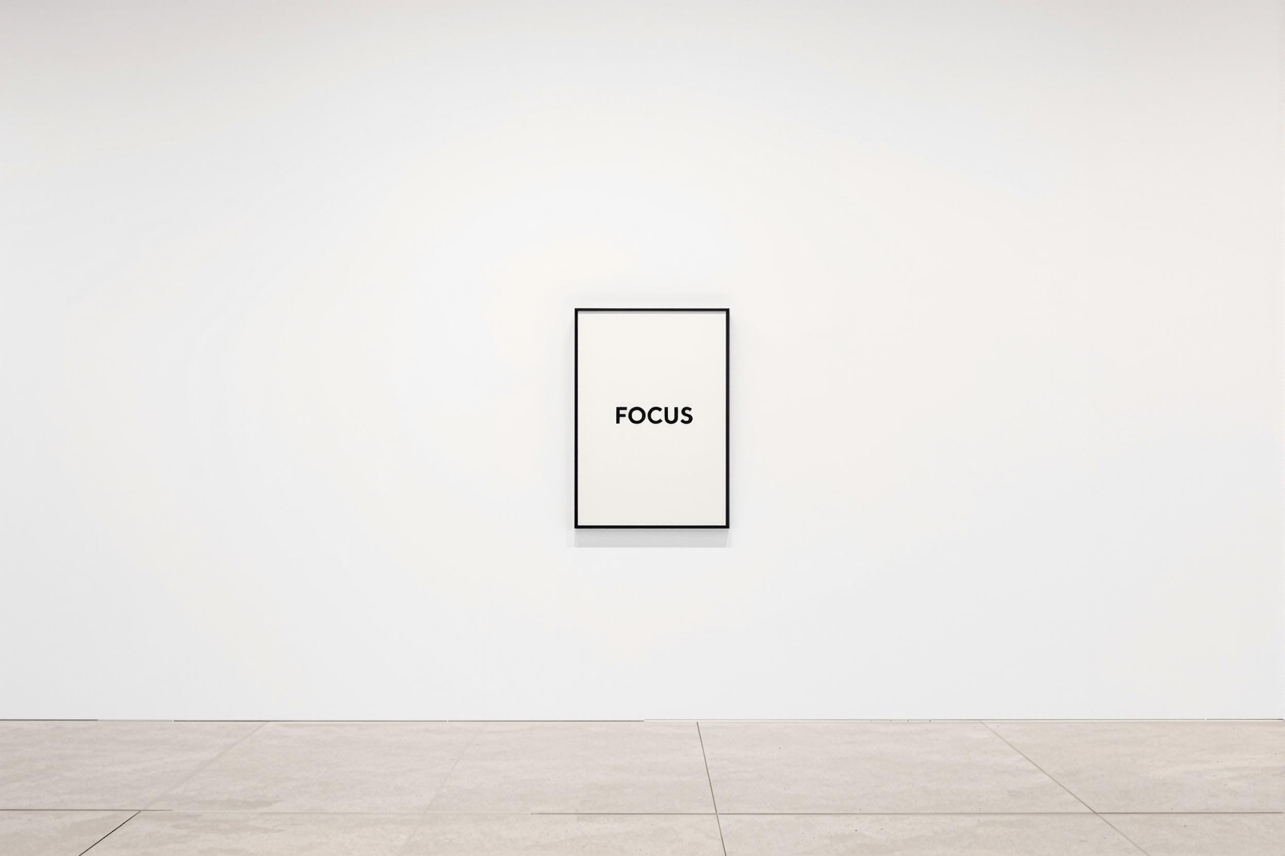 Gallery wall showing a poster with "FOCUS" written on it.